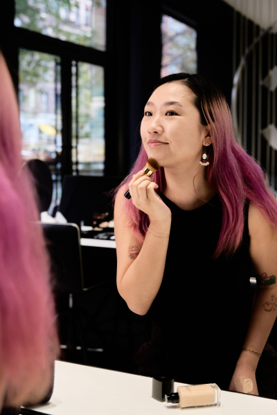 Sarah Han applying the Sublimage L'Essence de Teint in BD21